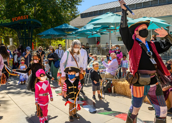 Halloween parade with pirate and kids in costume