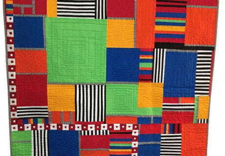 Kitchen Sink quilt by Lavialle Campbell in bright green, orange, and blue squares and rectangles