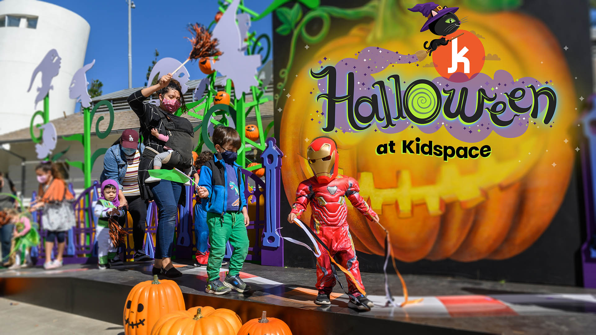 families parade on a halloween stage