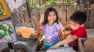 boy and girl at muddy boot farm store