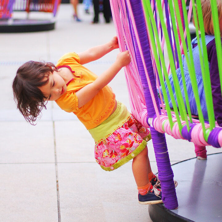 Girl Playing on a Los Trompos