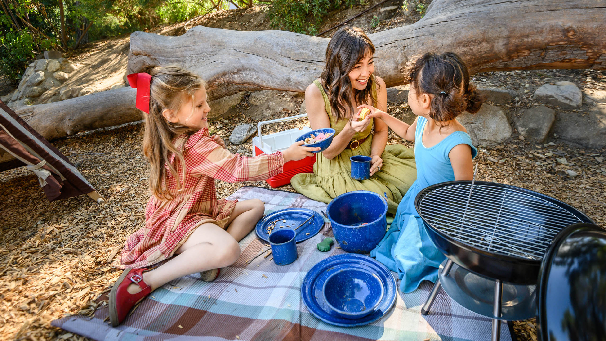 A family pretends to have a picnic