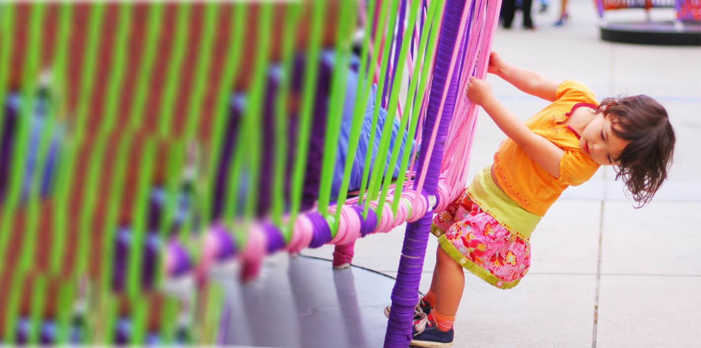 Child plays on Los Trompos