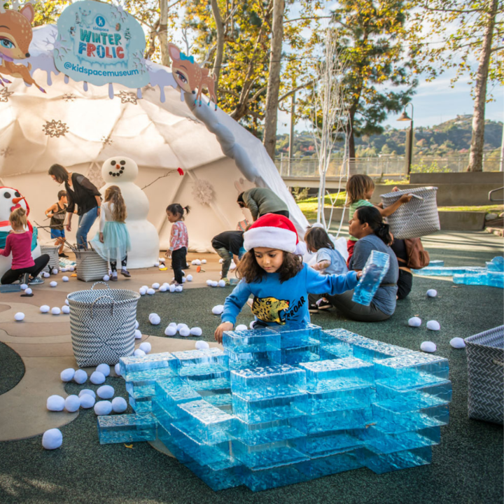 Child building with no-melt ice blocks