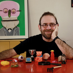 Artist Hanoch Piven posed with everyday objects
