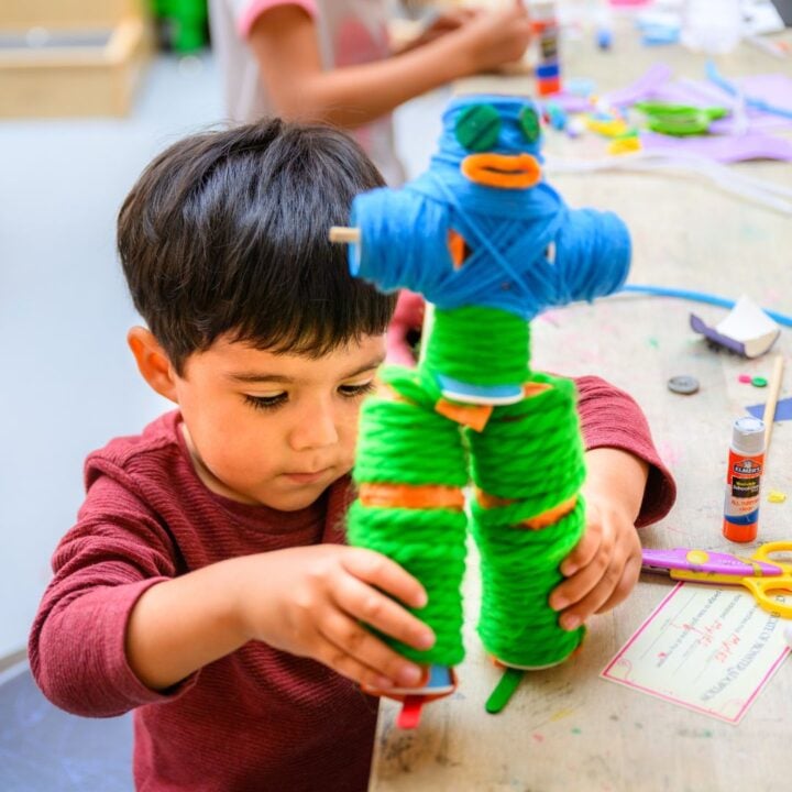 Child plays with hand-made monster