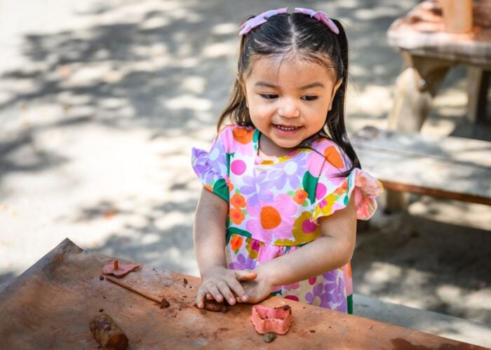 Toddler playing with clay