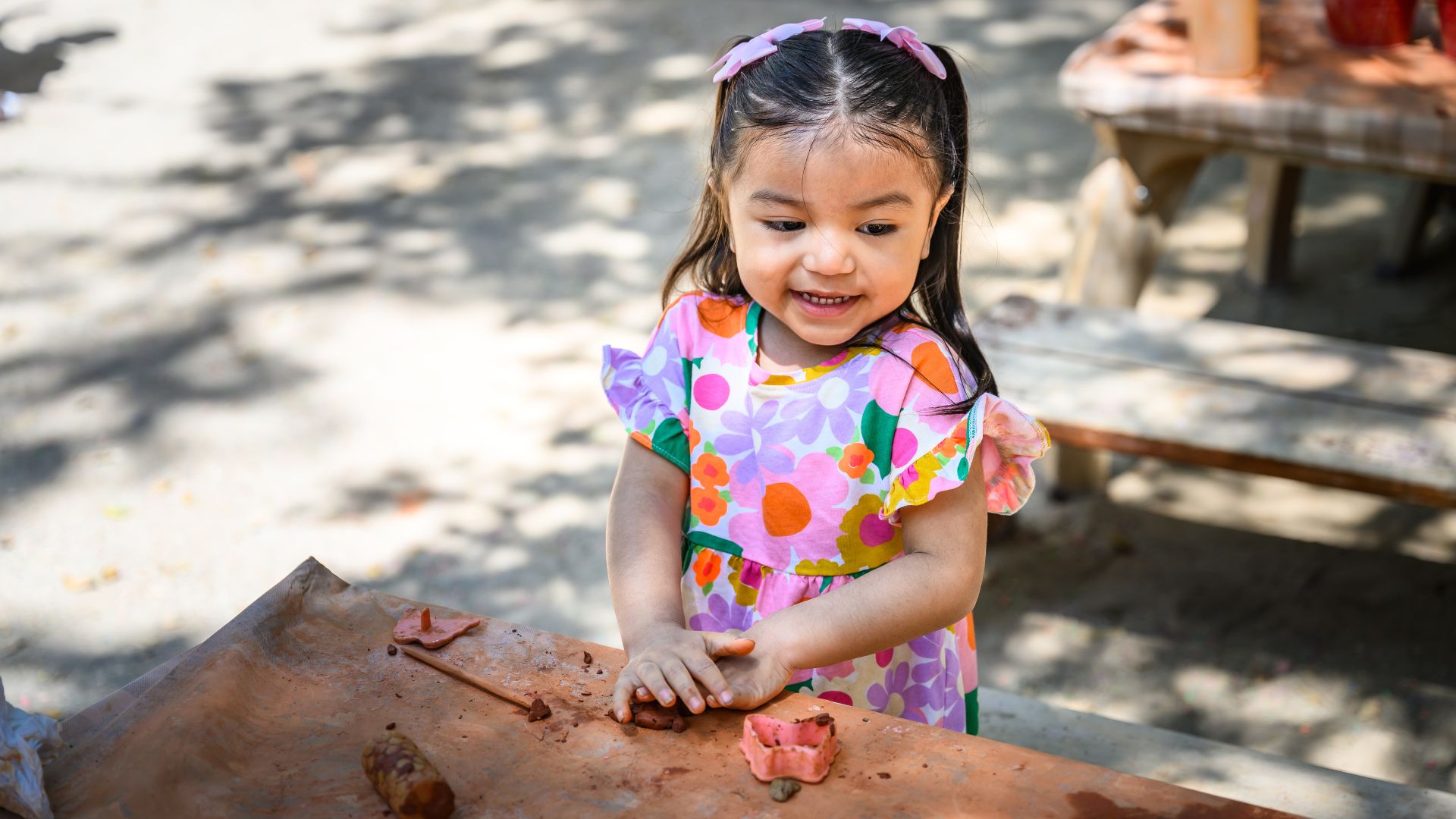 Toddler playing with clay
