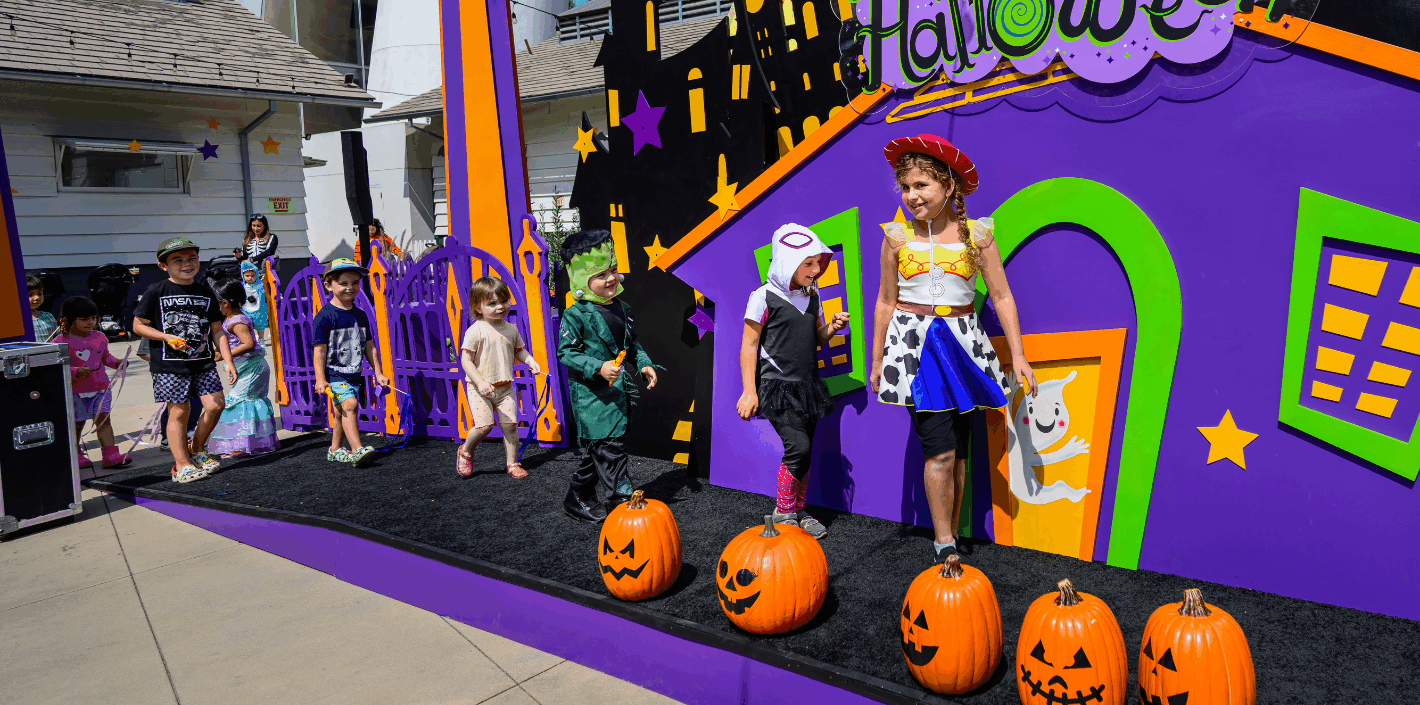 Children in a parade on a Halloween stage