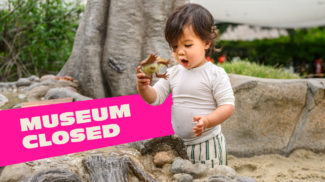 Child surprised with frog toy