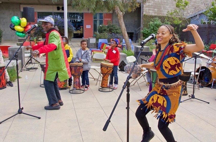 group of people dancing a celebrating