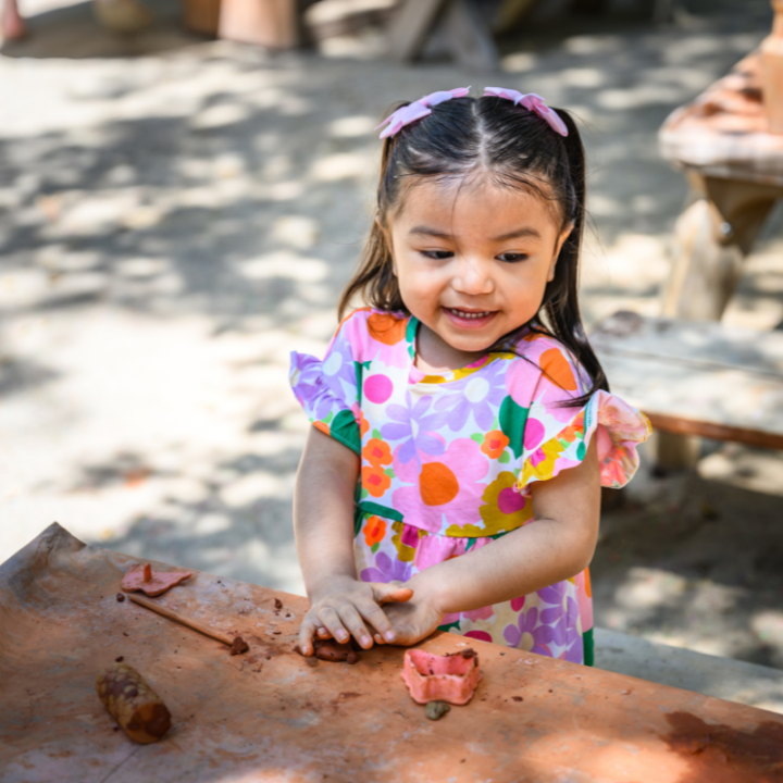 Child playing with clay