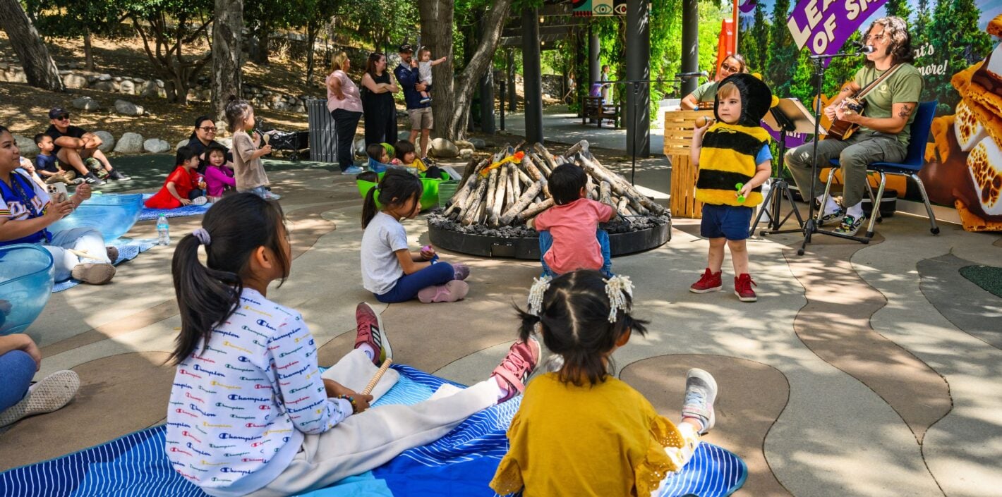 Children gather around. pretend campfire to sing songs