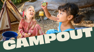 Two children pretending to campout